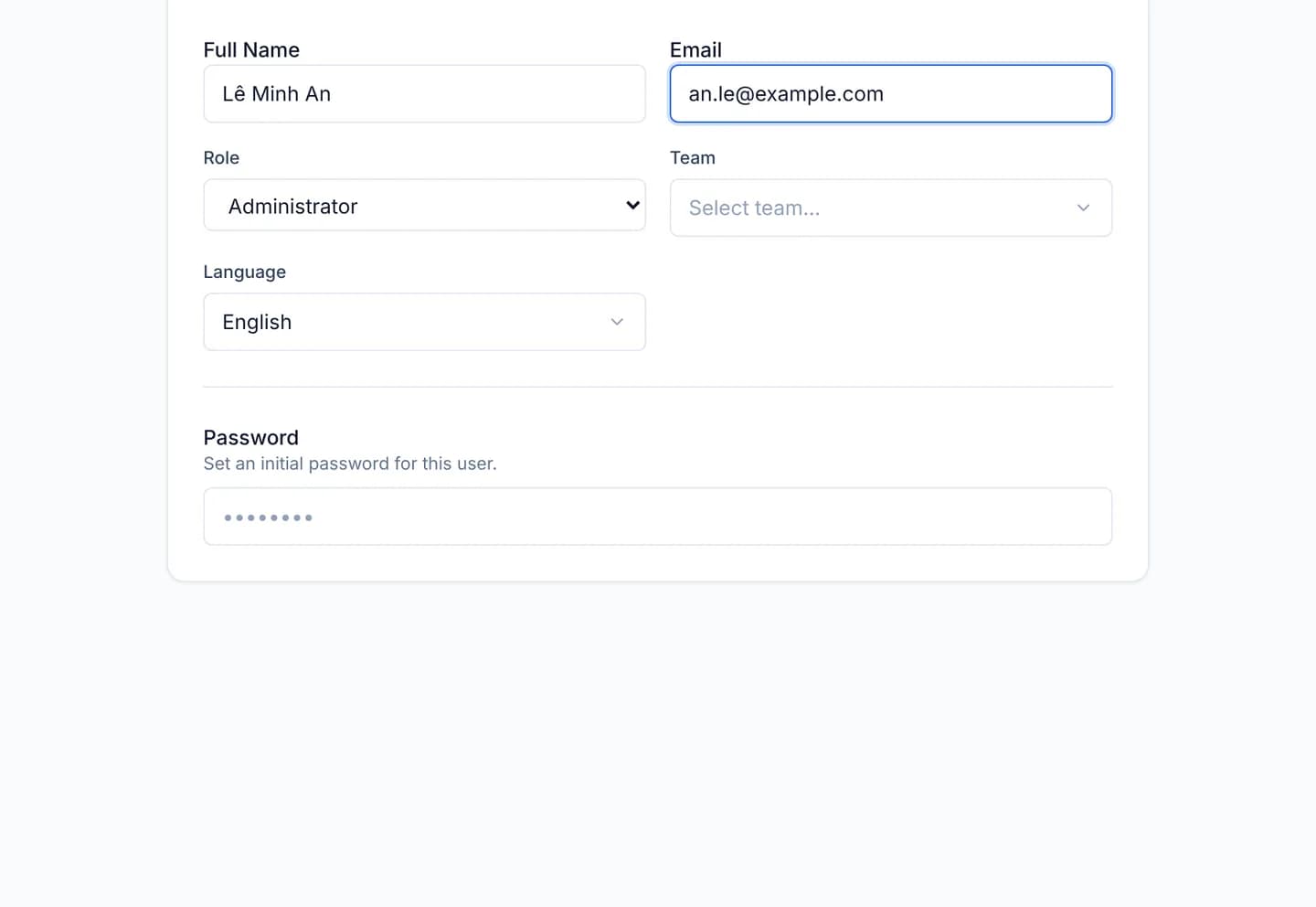 The user creation form with Full Name and Email filled in, the Role select showing Administrator, and the Team and Language selects beside it