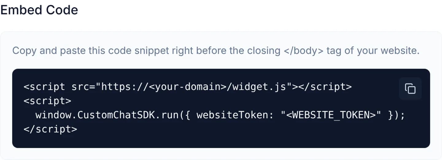 The Embed Code section of the Configuration tab: a dark code block holding two script tags, the websiteToken replaced by a placeholder, and a copy button in the top-right corner